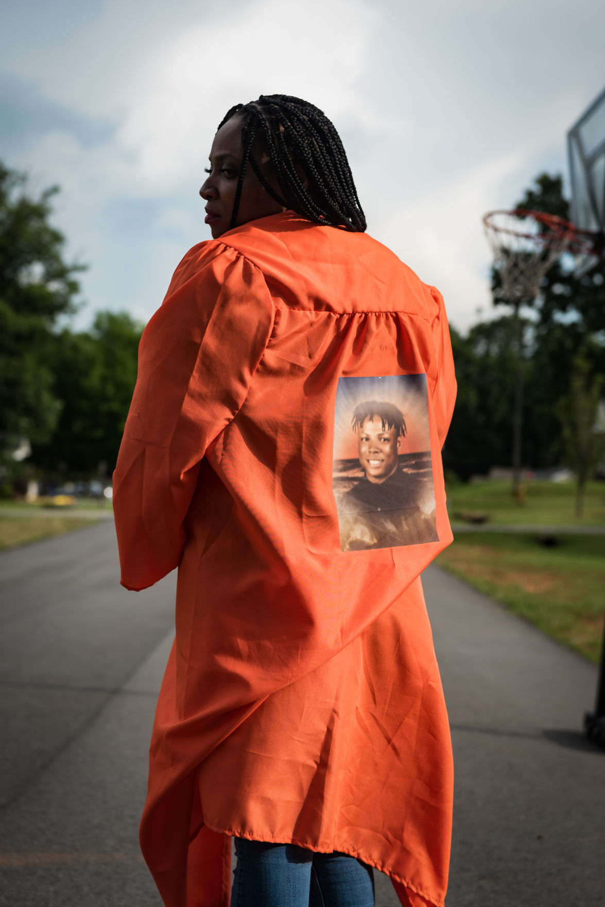 Nakeshia Collins accepts Glenn diploma for son Jumil Robertson